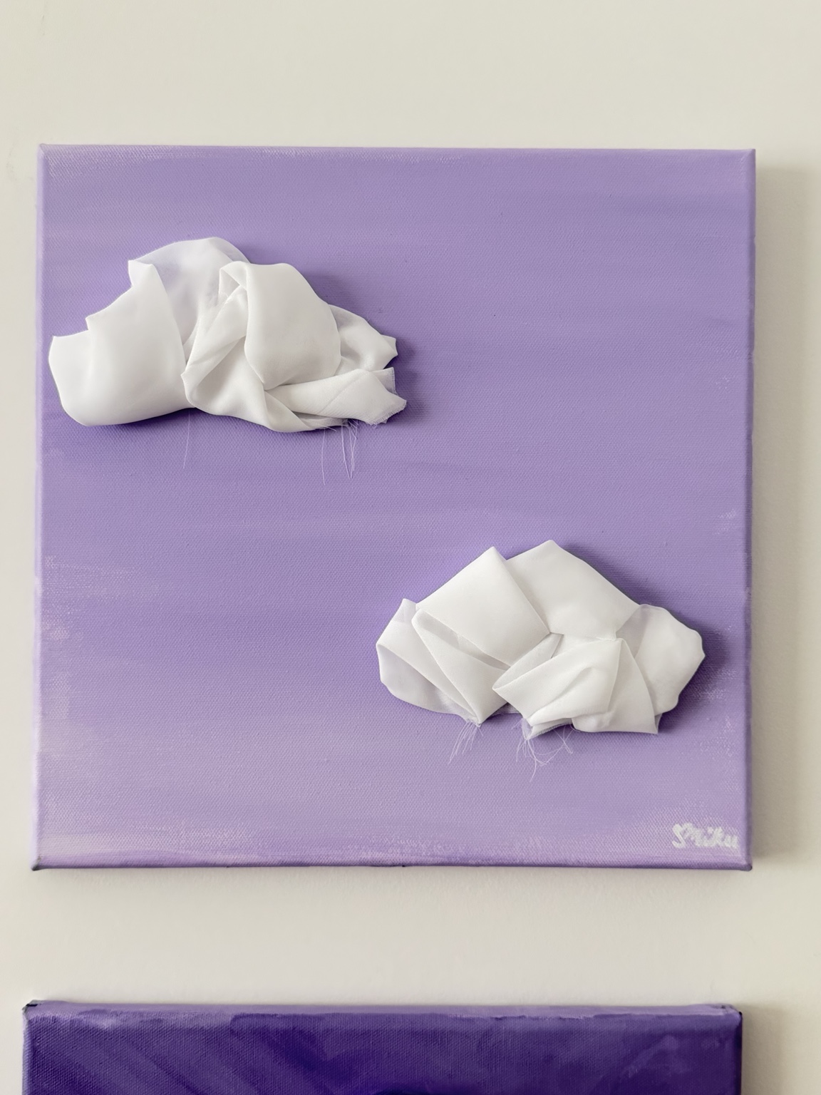 Tut tut, Two sculptural white fabric clouds on a lavender canvas